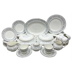 Royal Doulton tea and dinner wares in the Meadow Mist pattern, no H5007, comprising seven dinner plates, eight side plates, two lidded tureens, two jugs, lidded sucrier, oval serving dish, six teacups, seven saucers, seven tea plates and large saucer