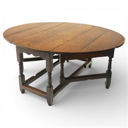 18th century large oak gateleg table, of plank top construction with visible dowels, with drop leaves to form an oval table 167cm in width, raised on block and turned supports