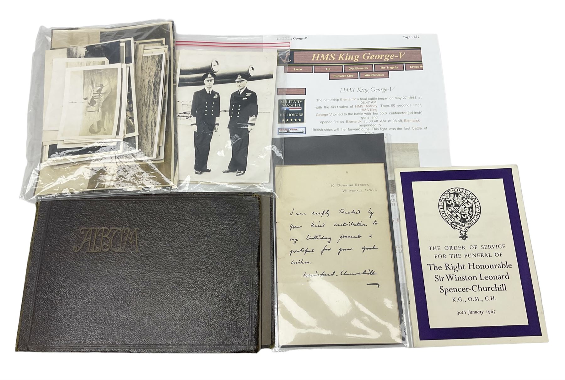 Disbound WW2 album relating to the battleship HMS King George VI containing over fifty various size loose photographs of the ship in action, guns firing, crew members, aircraft, two of George VI on board, three of Winston Churchill on board, official 1942 Christmas messages including Franklin Roosevelt etc; together with unrelated printed letter on 10 Downing Street notepaper from Winston Churchill; and Order of Service for Churchill's funeral at St. Paul's Cathedral 30th January 1965