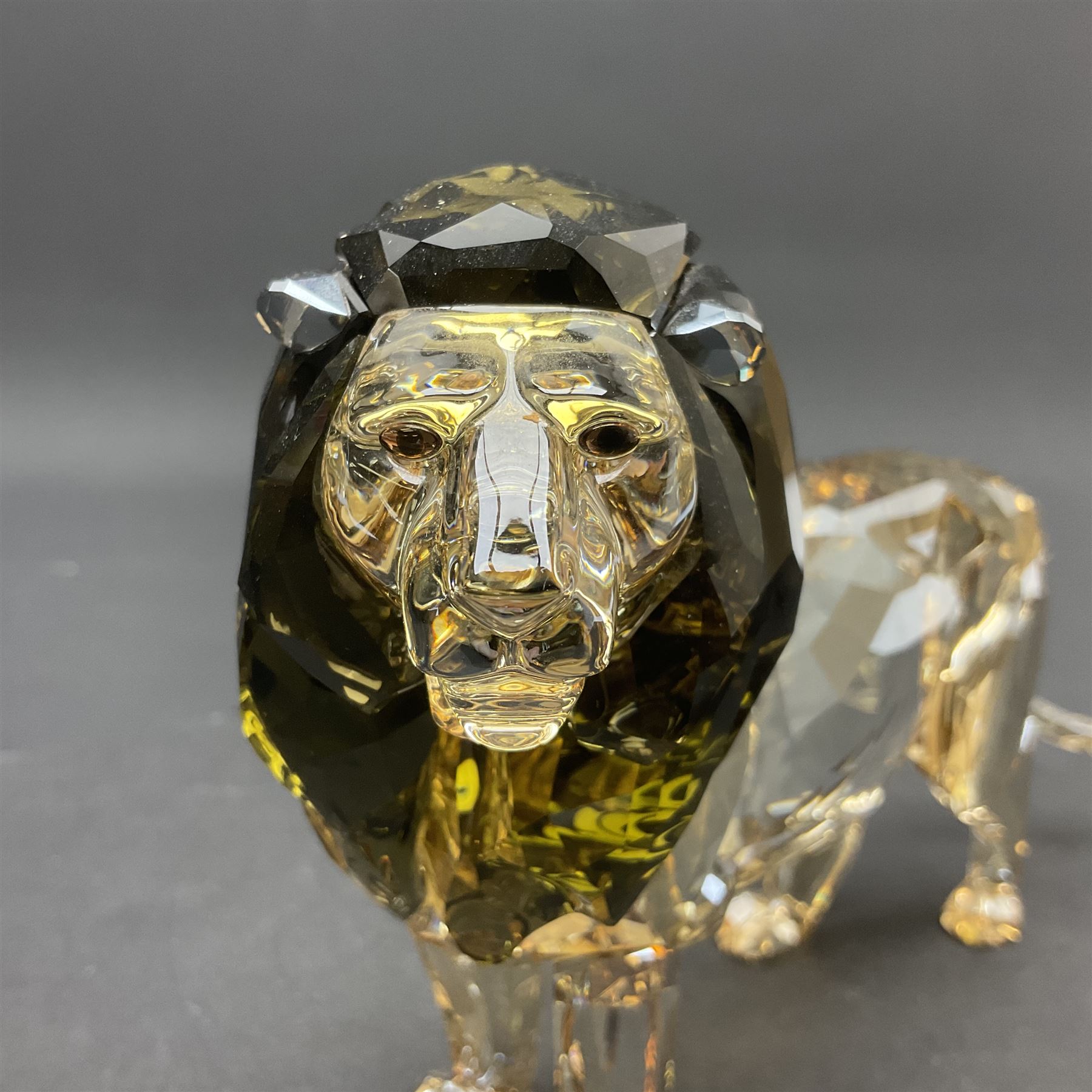 Swarovski Crystal lion, Akili, together with small Swarovski Crystal plaque with lion silhouette, H13cm