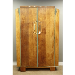  Art Deco 'Heals of London' style three piece oak bedroom suite double wardrobe with interior mirror and hanging (W122cm, H187cm, D46cm), tallboy with cupboard and two drawers (W92cm, H117cm, D46cm), drop centre dressing table with seven drawers and circular bevelled mirror (W106cm, H147cm, D47cm), with green painted detail and carved mounts  