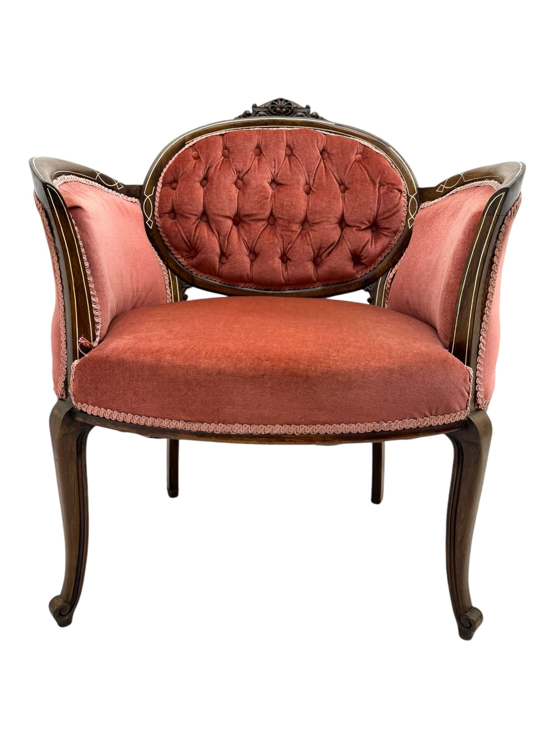 Edwardian inlaid rosewood parlour suite, comprising pair of tub shaped armchairs (W77cm, D69cm, H88cm); and matching two-seat sofa (W112cm, D69cm, H88cm), each with carved crest rails with shell motifs, deep button-tufted oval backs upholstered in pink fabric with braid trim, on cabriole supports