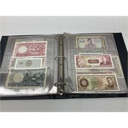 World banknotes, including Queen Elizabeth II The States of Jersey one pound 'DB202703', five pounds 'BB527762' and ten pounds 'AB651481', reserve bank of New Zealand two dollars '1L3 741894', King George V Straits Settlements one dollar 1st January 1935 'F/83 28924', various Bank of England notes etc, housed in two ring binder albums