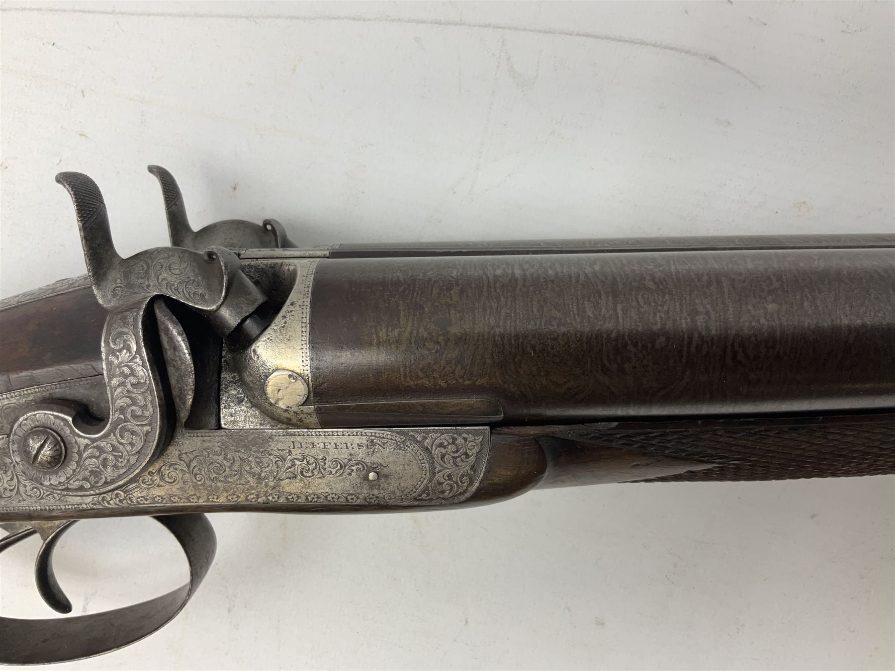 19th century John Jefferson of Scarborough 6-bore (modern 4-bore) double barrel side-by-side percussion gun, with 81cm stub twist damascus barrels (no provision for ramrod), well figured walnut stock with fine chequered grip and fore-end with horn tip and steel butt plate with long tang, well engraved lock and hammers with half-cock safeties on both sides, barrel sling swivel but rear sling swivel removed and replaced with silver escutcheon, London proofmarks, NVN, L128cm