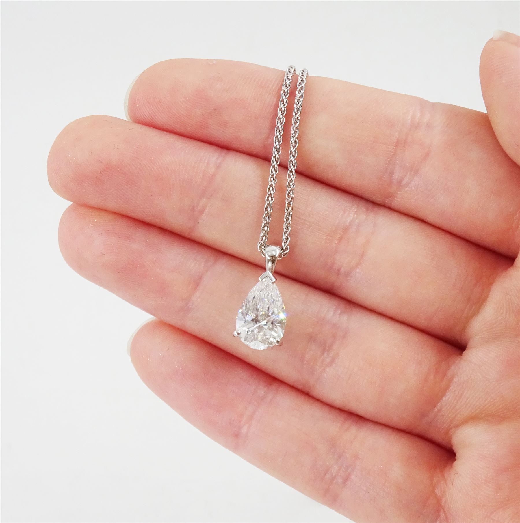 Platinum diamond pendant, set with a single pear cut diamond of 2.00 carat, colour D, clarity VS2, with GIA report, on 18ct white gold fancy link chain necklace