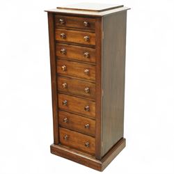 Victorian mahogany Wellington chest, the rectangular top above eight graduated drawers each fitted with turned knobs, flanked by hinged locking stiles, raised on a plinth base