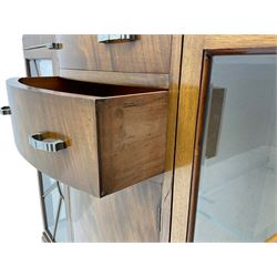 Mid-20th century Art Deco style walnut display cabinet, two central drawers over cupboard flanked by two bevel glazed display cabinets with sunburst astragal glazing, on ball and claw cabriole feet