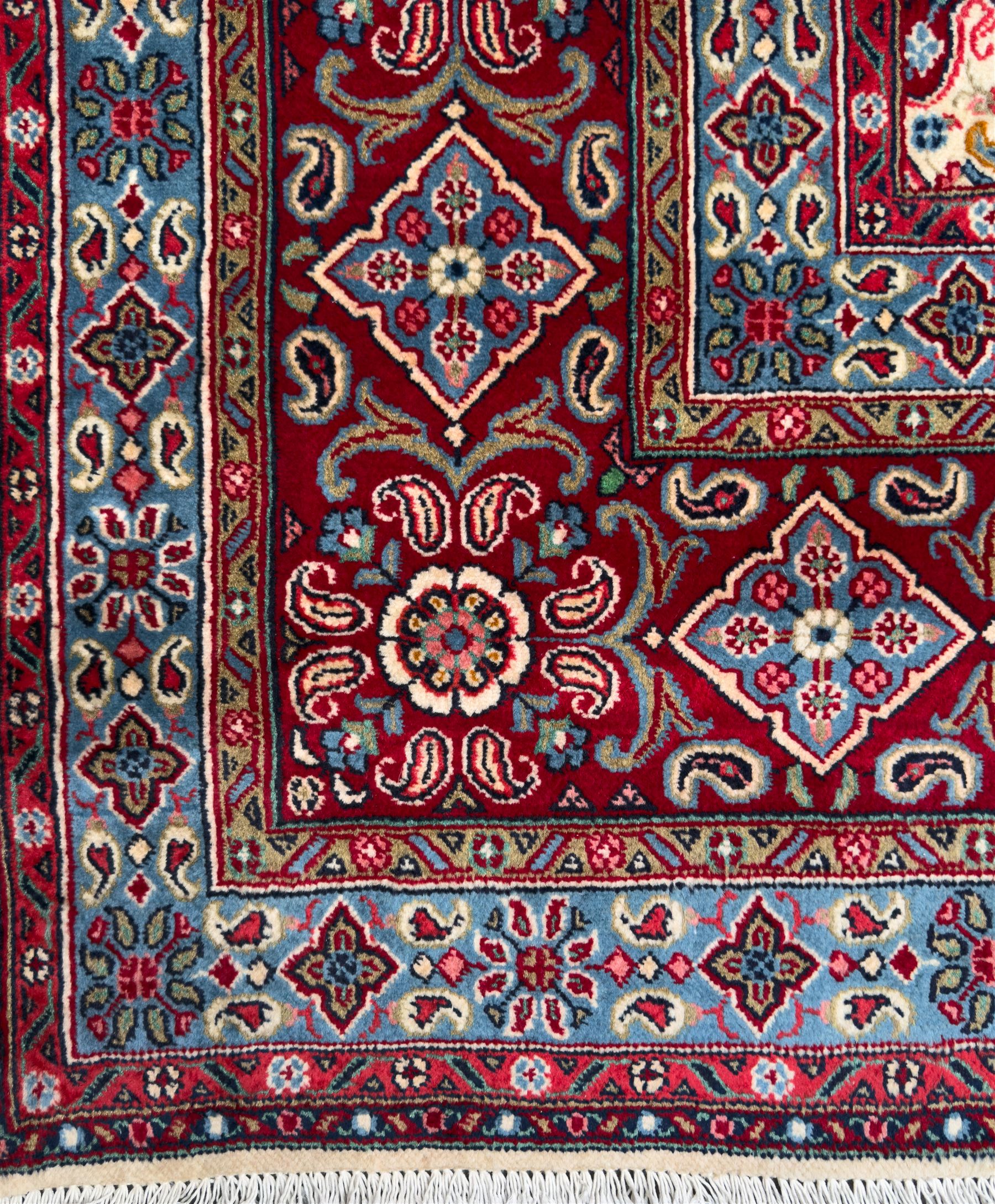 Northwestern Persian Hamadan carpet, hand-knotted, ivory field with an all-over Herati design of rosettes and serrated leaves within multiple borders, madder red with angular vine and rosette motifs, 375cm x 271cm 