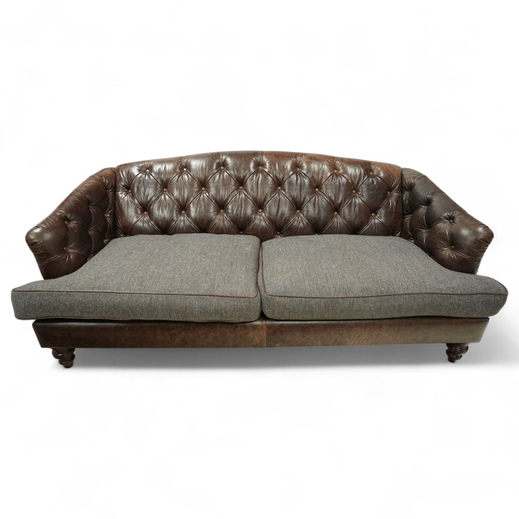 Tetrad - Harris Tweed and leather upholstered Chesterfield sofa, curved back and arms  with deep buttoned brown leather upholstery above loose herringbone tweed seat cushions with brown leather piping, raised on turned wooden feet 