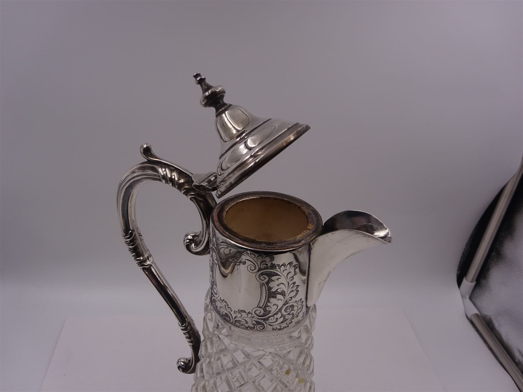 Modern silver mounted glass claret jug, with capped C scroll handle, engraved collar and urn finial to cover, hallmarked Charles S Green & Co Ltd, Birmingham 1973, H32.4cm