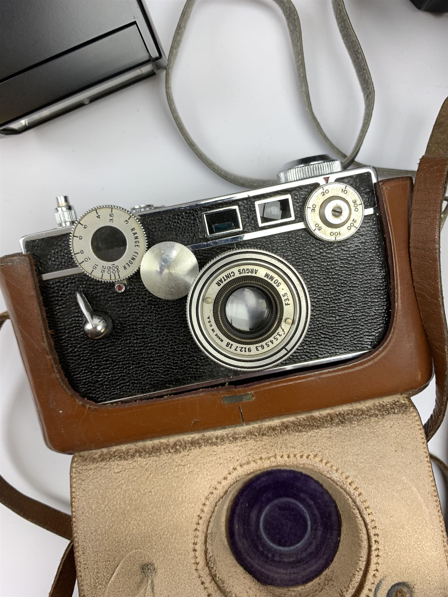 Vintage cameras lenses and accessories including Olympus 'OM10' camera body, Olympus 'OM4' camera, 'Olympus OM-System Zuiko auto-zoom 35-70mm 1:4' lens, various other lenses, tasco binoculars etc, in one box