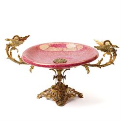 Large gilt brass tazza, with fuchsia bowl, with various baroque motifs including two swans...