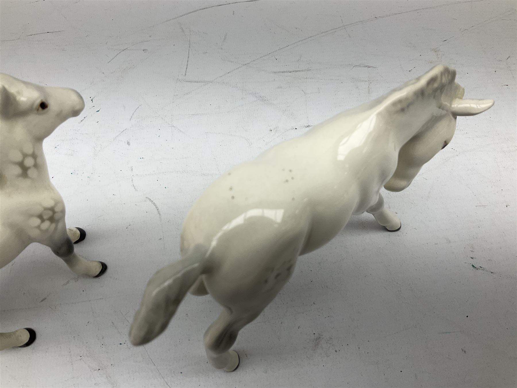 Seven Beswick figures of horses, including Connemara pony in grey no.1641, Arab in bay no.1265, large foal in grey no.947 etc, together with a Goebel figure of a horse (8)