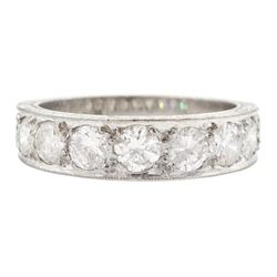 White gold seven stone round brilliant cut diamond ring, the sides with engraved decoratio...