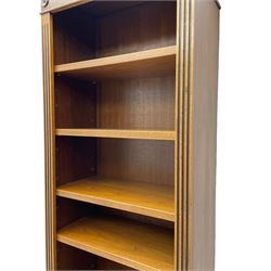 Georgian design walnut open bookcase, projecting cornice over figured banded frieze flanked by roundels, fitted with six adjustable shelves with flanking fluted uprights, on skirted base