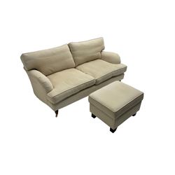 Two seat traditional shape sofa, upholstered in pale fabric; together with rectangular footstool