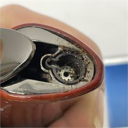 Collection of lighters, including Ronson Varaflame, Zorr Classic, Dunhill bark effect roller gas lighter, and faceted blue glass table lighter, etc