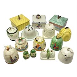 Clarice Cliff for Wilkinson Ltd Crocus Bizarre beehive honeypot painted in the Crocus pattern, together with two beehive Beswick honey pots, Poole square honey pot etc (14)