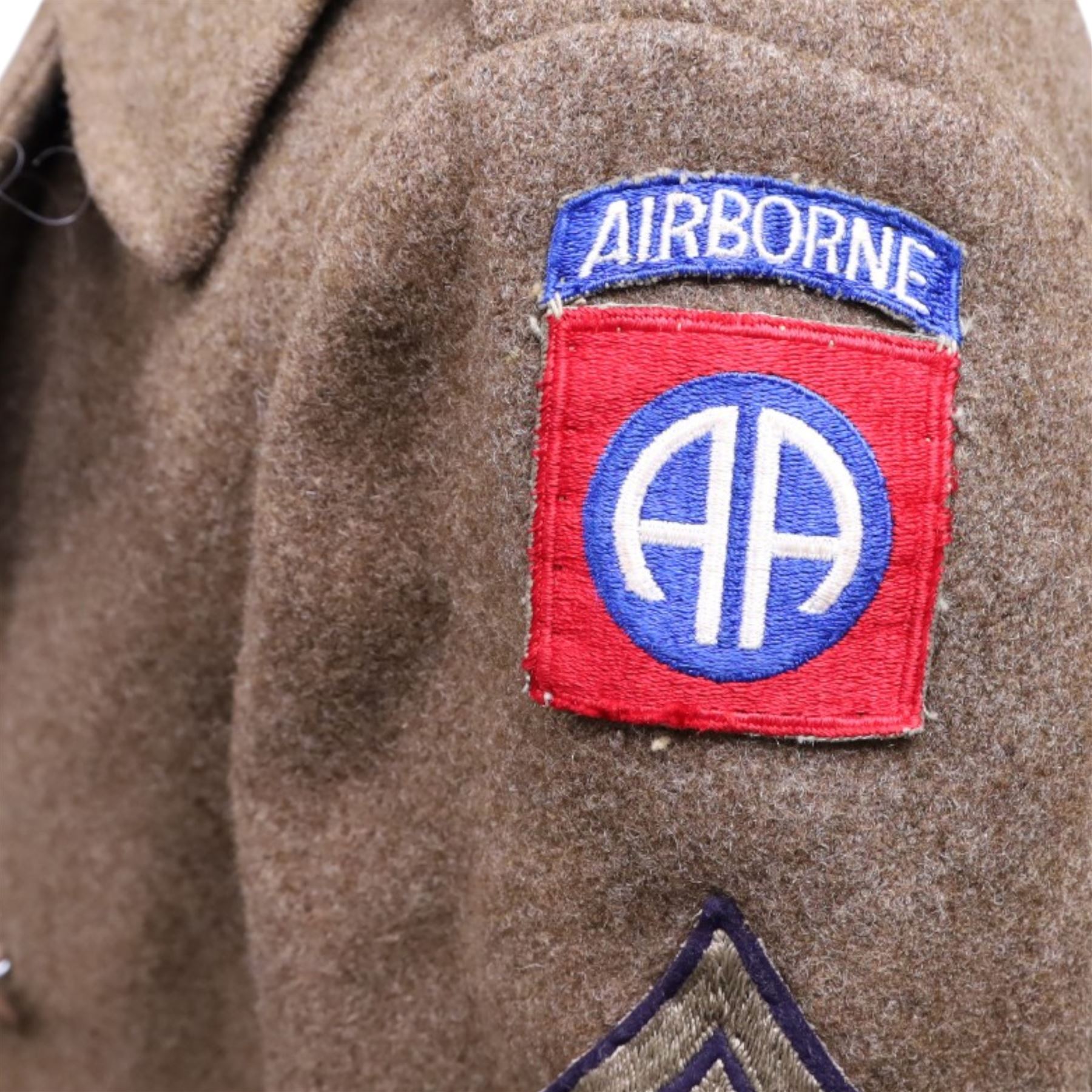 Army long wool jacket, with US Army WWII 82nd Airborne division patch, stamped inside 36R