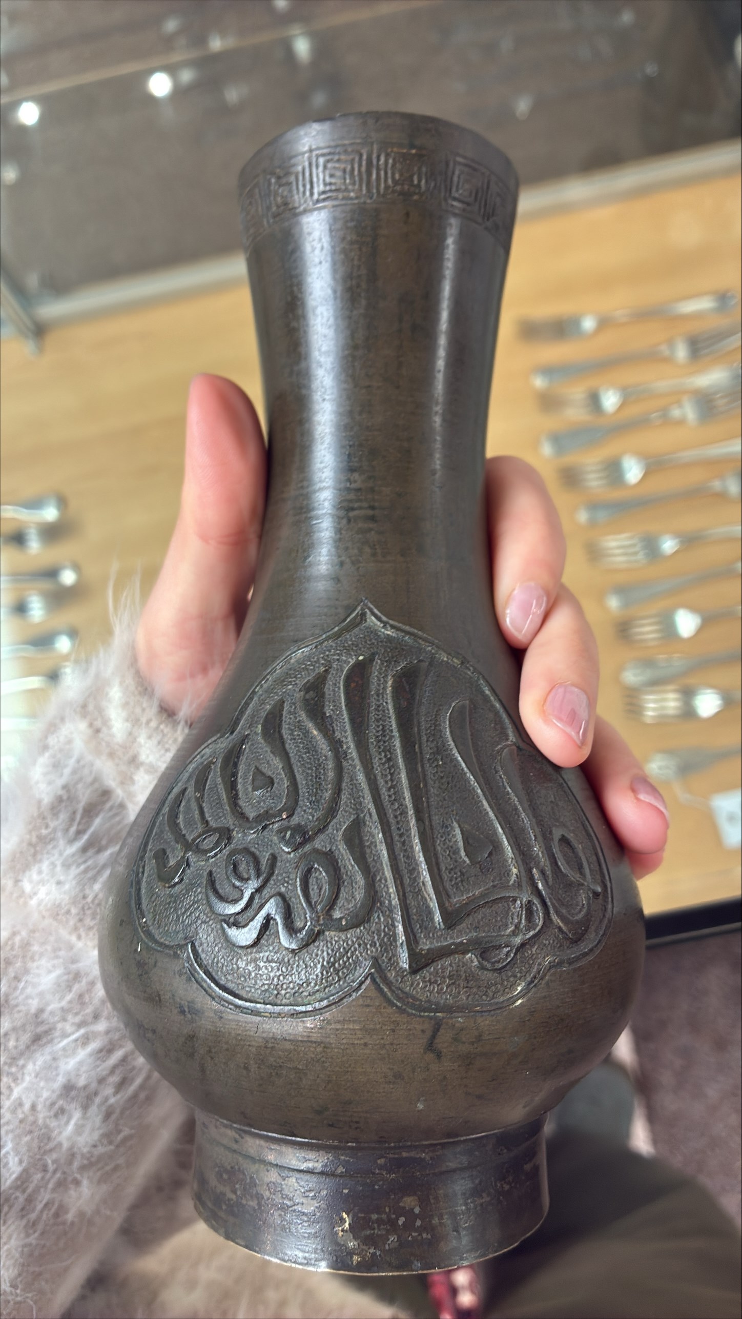 Chinese bronze vase, the cartouches containing Arabic characters on a granulated ground, unmarked H19cm