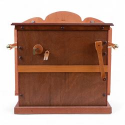 John Smith-20th century hand cranked portable street organ “music and mirth” in a wooden case with carrying handles, with speaking pipes and mannequin to the front. All pipes present, however the mechanism is in need of restoration. With five paper music rolls.