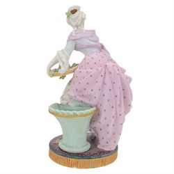 Pair of late 19th century French Letu & Mauger bisque figures, modelled as a gallant and his companion, with impressed marks beneath, H35.5cm, together with a 19th century French mantle vase, in the manner of Jacob Petit, the vase of cornucopia form painted with rose sprays and heightened with gilt, mounted with the figure of a trumpet player, upon a naturalistically modelled base mounted with a recumbent goat, H35cm