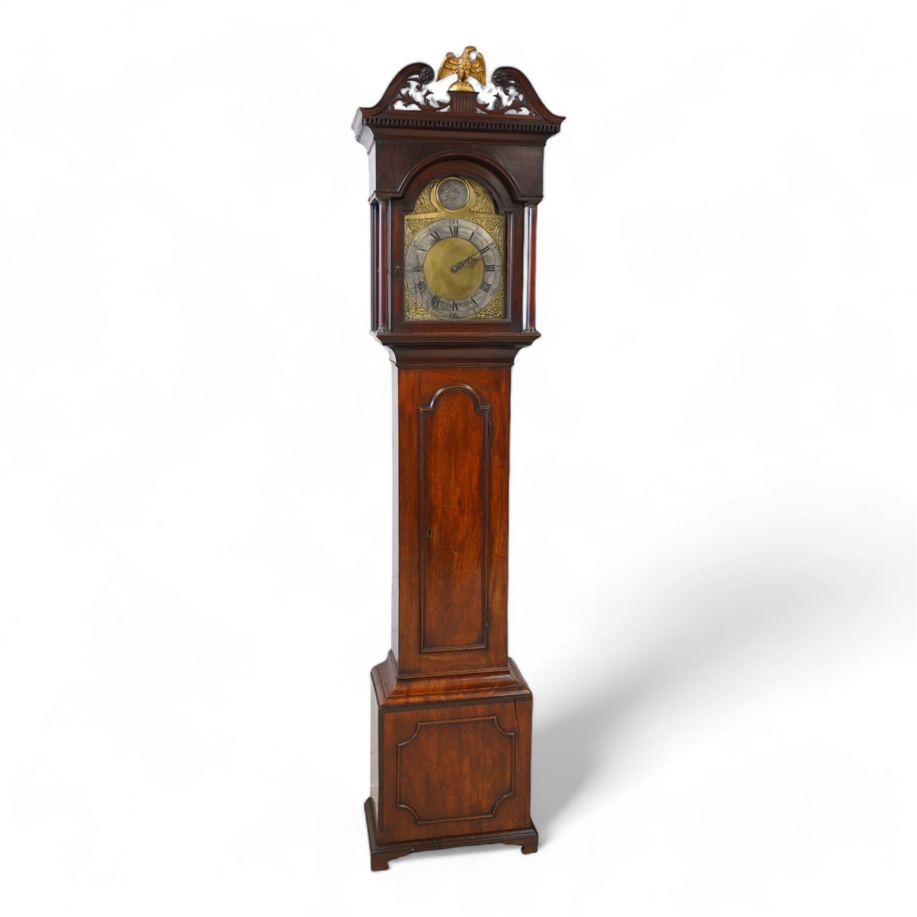 Johnathan Storr of York - 30 hour longcase clock c1770, in a later mahogany case with a decorative swan neck pediment, carved gilded eagle and fretwork, with a dogtooth moulding, break arch hood door and detached pilasters beneath, trunk with a conforming break arch topped door on a square plinth with raised moulding and bracket feet, brass arched dial with makers name to the arch, plain dial centre and silvered chapter ring with Roman numerals, five minute Arabic's, minute track and matching steel hands, chain driven movement with a countwheel strike on a bell. No Pendulum or weight.
Johnathan Storr was an 18th century York clockmaker, working from Petergate and Minster gates in the city centre.