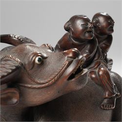 Early 20th century Chinese carved hardwood figural group of two boys on the back of a water buffalo on wooden stand W37cm