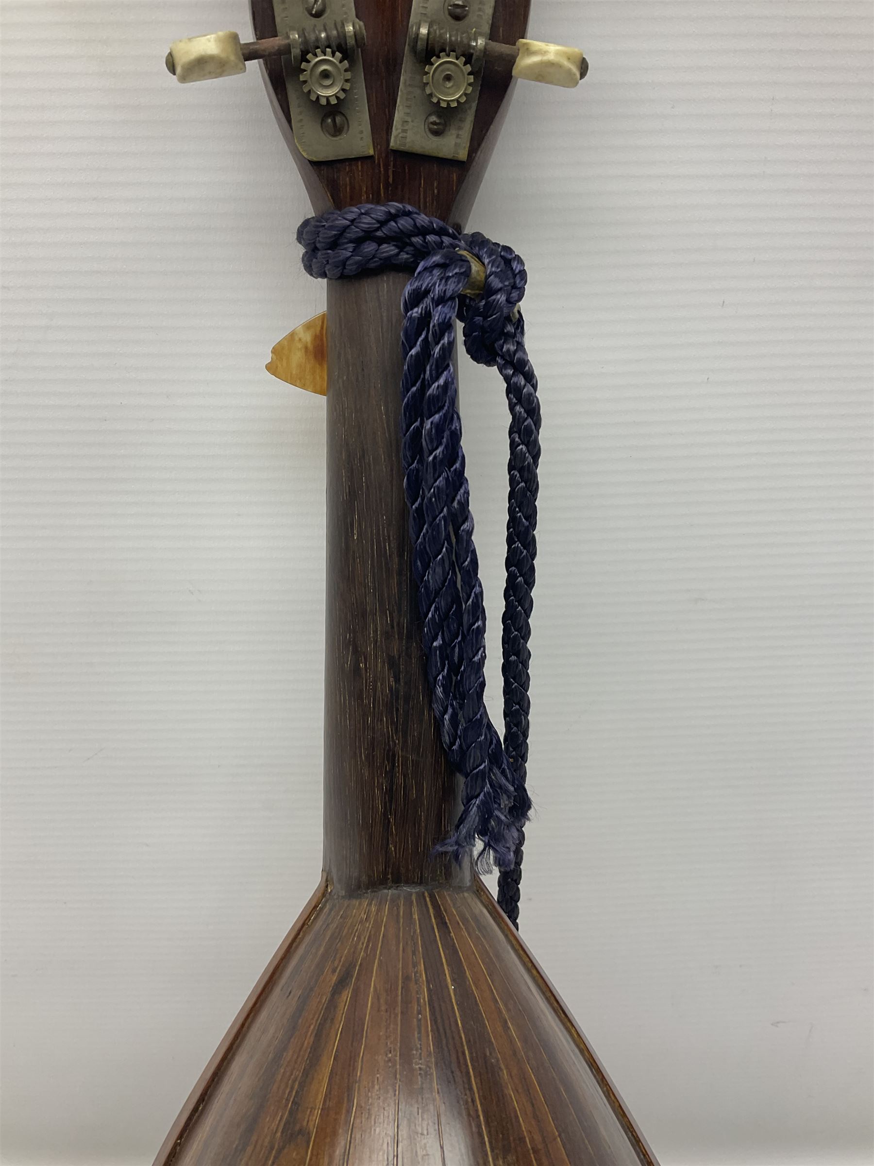 Late 19th/early 20th century Italian lute back mandolin with segmented back and spruce top; bears maker's label for Pietro Tonelli Napoli; together with a mandolin instruction booklet and a folding music stand L60.5cm