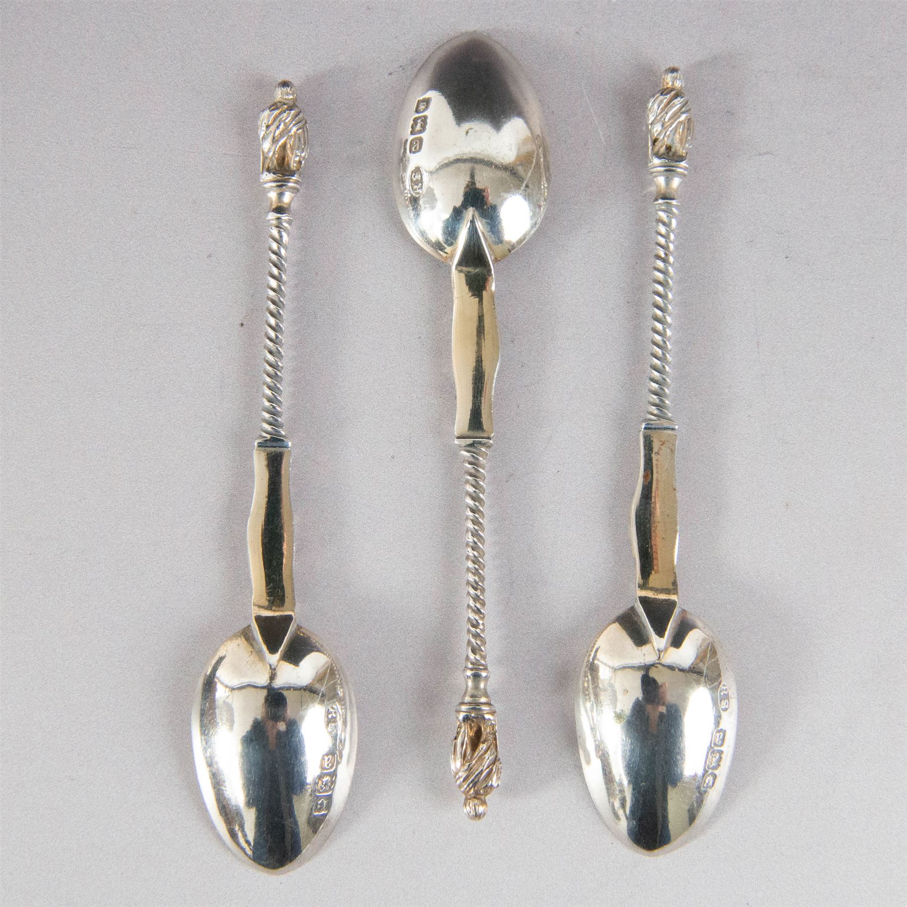 Set of six late Victorian silver apostle spoons and sugar tongs, hallmarked Robert Stebbings, London 1897, in fitted cased with silk and velvet lined interior