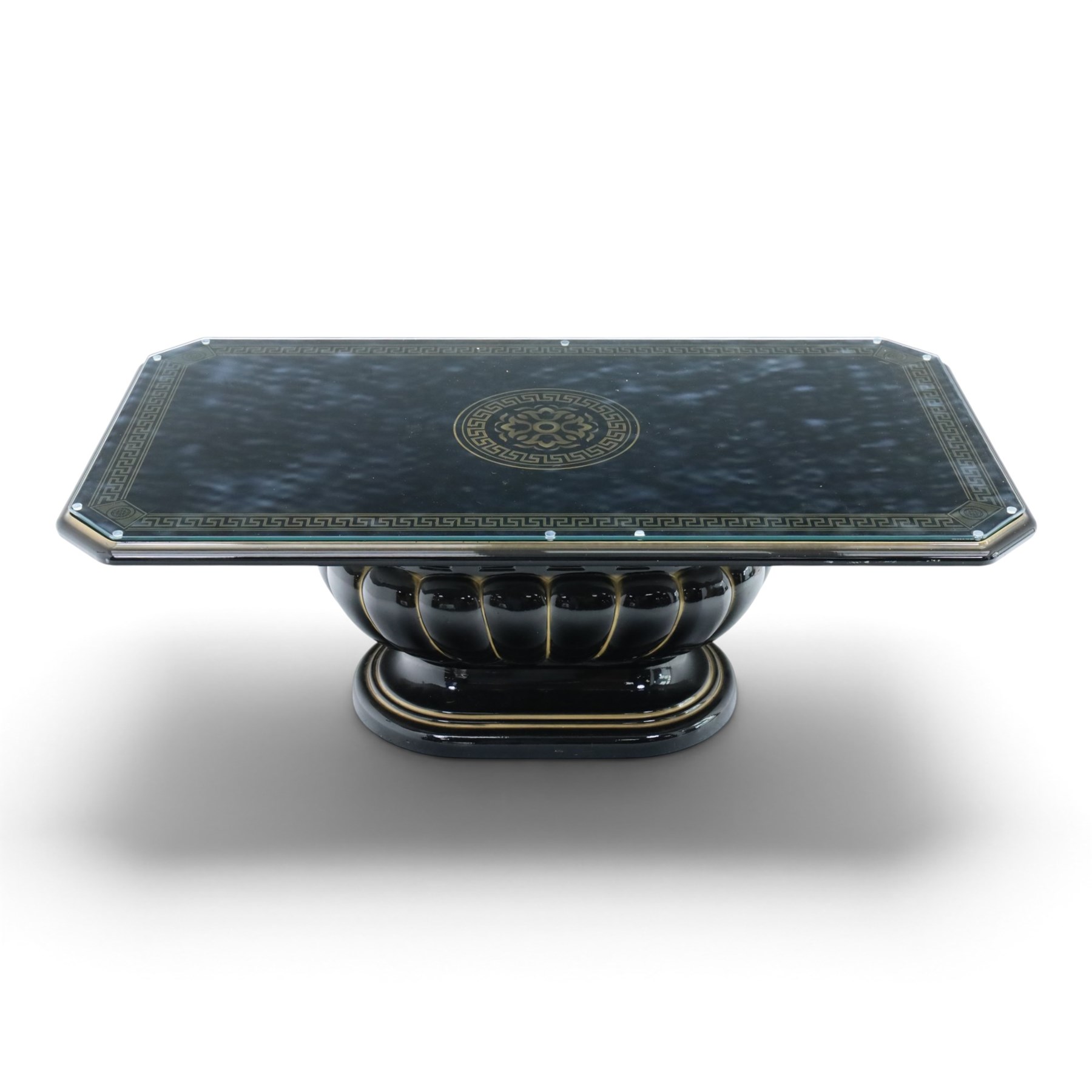 Italian Neoclassical inspired ebonised gloss coffee table, glazed cantered top with Greek key banding, on a shaped pedestal base with gilt highlights and stepped plinth 