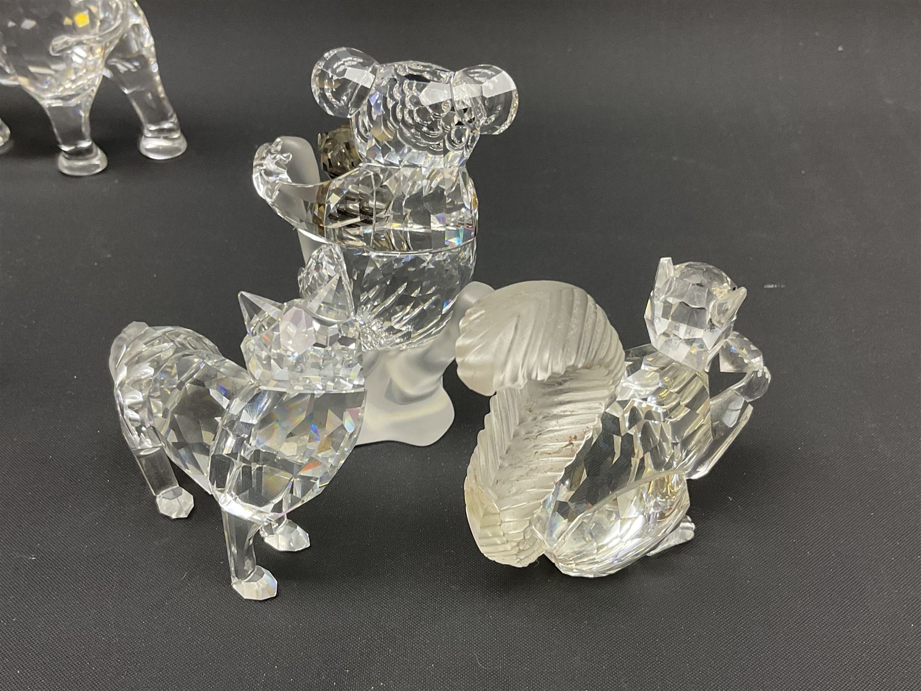 Twenty nine Swarovski Crystal animals, to include koala and baby, in frosted tree branch, elephants, polar bears, squirrel, monkeys, panda, unicorn and snails, etc 