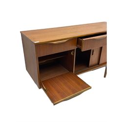 Mid-20th century circa. 1970s teak sideboard, three drawers over fall front cupboard and two sliding doors, on tapering supports