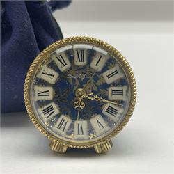 Bueche Girod silver-gilt and enamel novelty miniature clock, with a band of gilt moon and star decoration upon a deep blue enamel ground, with enamel and gilt foliate dial, with musical mechanism playing happy birthday, D2.7cm, in suede pouch