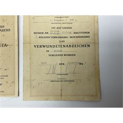 Three German documents dated 1942 - Gold Cross award to Major Ludwig Osterkampf; and Crete wound certificate and cuff title certificate awarded to Feldwebel Alfred Glaise; all unframed (3)