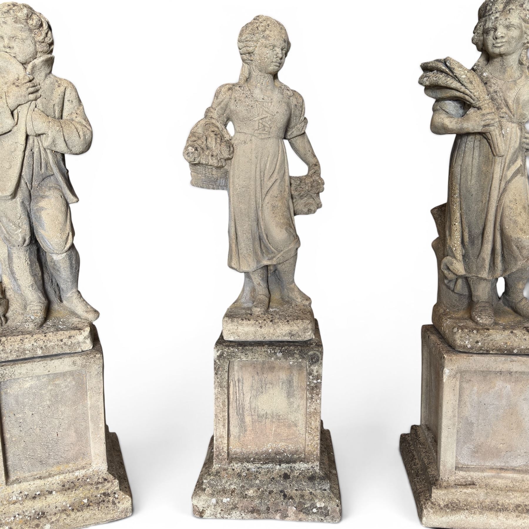 The Four Seasons - set of four traditional cast stone garden figures, in a weathered finish, stamped 'Lucas'