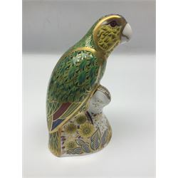 Two Royal Crown Derby paperweights, comprising Amazon Green Parrot, limited edition 1639/2500, with gold stopper and White Swan, with silver stopper, both with printed mark beneath and original box