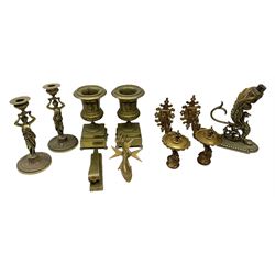 Group of metal ware, to include a brass table lamp modelled as a zoomorphic creature, pair of brass figural candlesticks, pair of brass urns, etc., in one box 