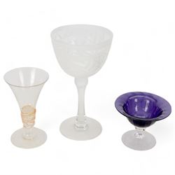Gillies Jones of Rosedale oversized wine glass, decorated with white abstract decoration, together with a smaller Gillies Jones of Rosedale trumpet shaped wine glass with applied coloured glass ribbon to stem and a Deborah Fladgate purple fluted glass dish, all signed to base, tallest H24.5cm