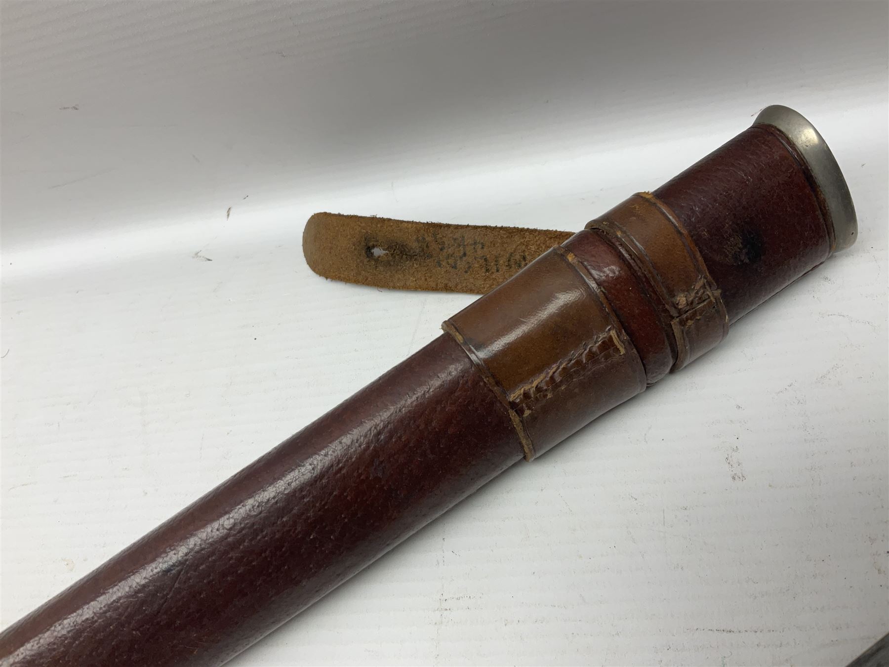 WWI 1821 pattern Royal Artillery officer's sword, the 82.5cm decorative blade by Hawksworth Sheffield etched with GVR cypher and crown, 'Royal Artillery' and field gun between scrolling foliate panels; three-bar hilt with wire-bound fish skin grip and chequered backstrap; in leather covered scabbard L99cm overall