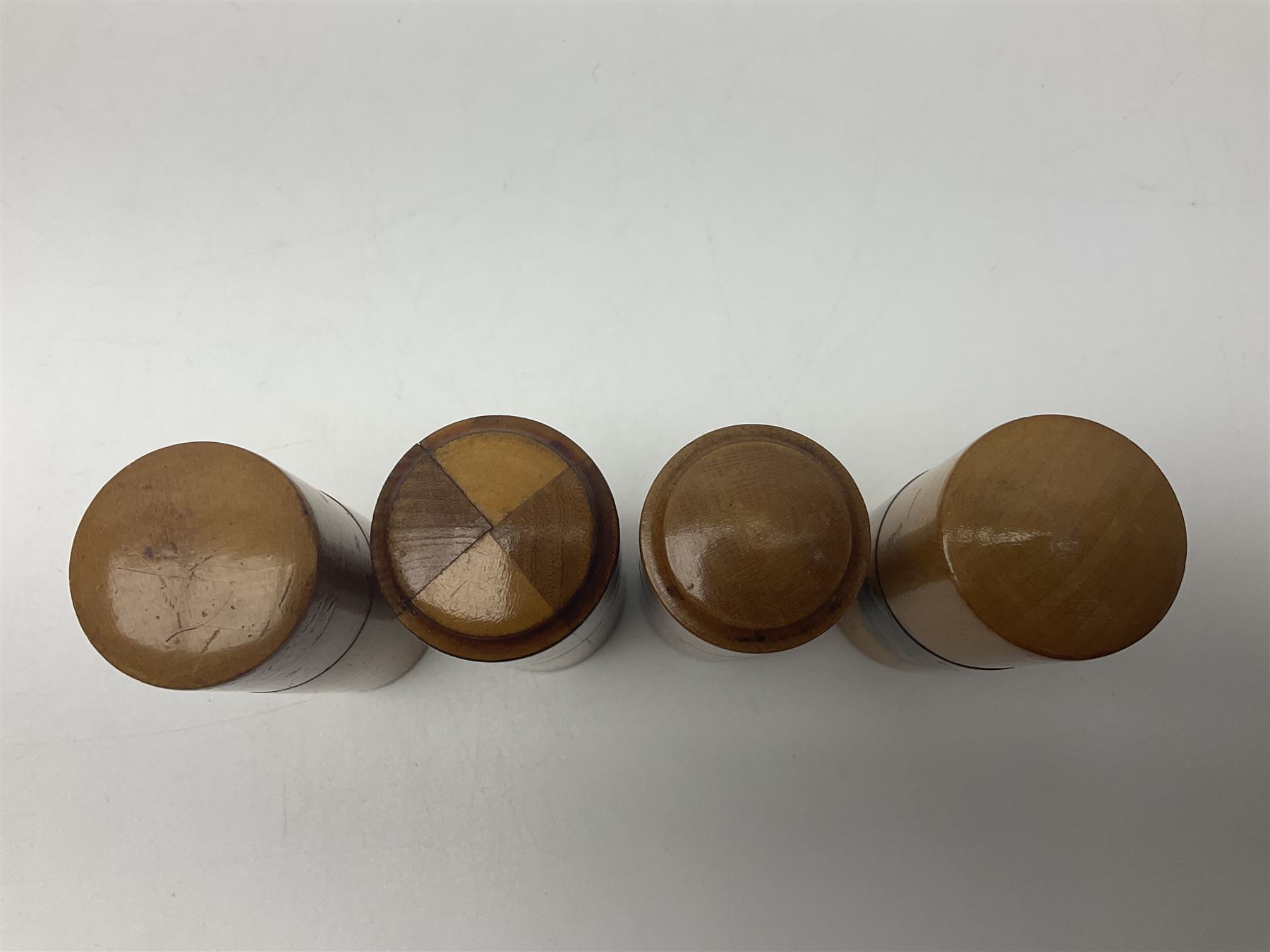 Collection of Mauchline ware relating to sewing, to include four ovoid shaped thimble cases, hinged lid thimble case and needle cases (12) 