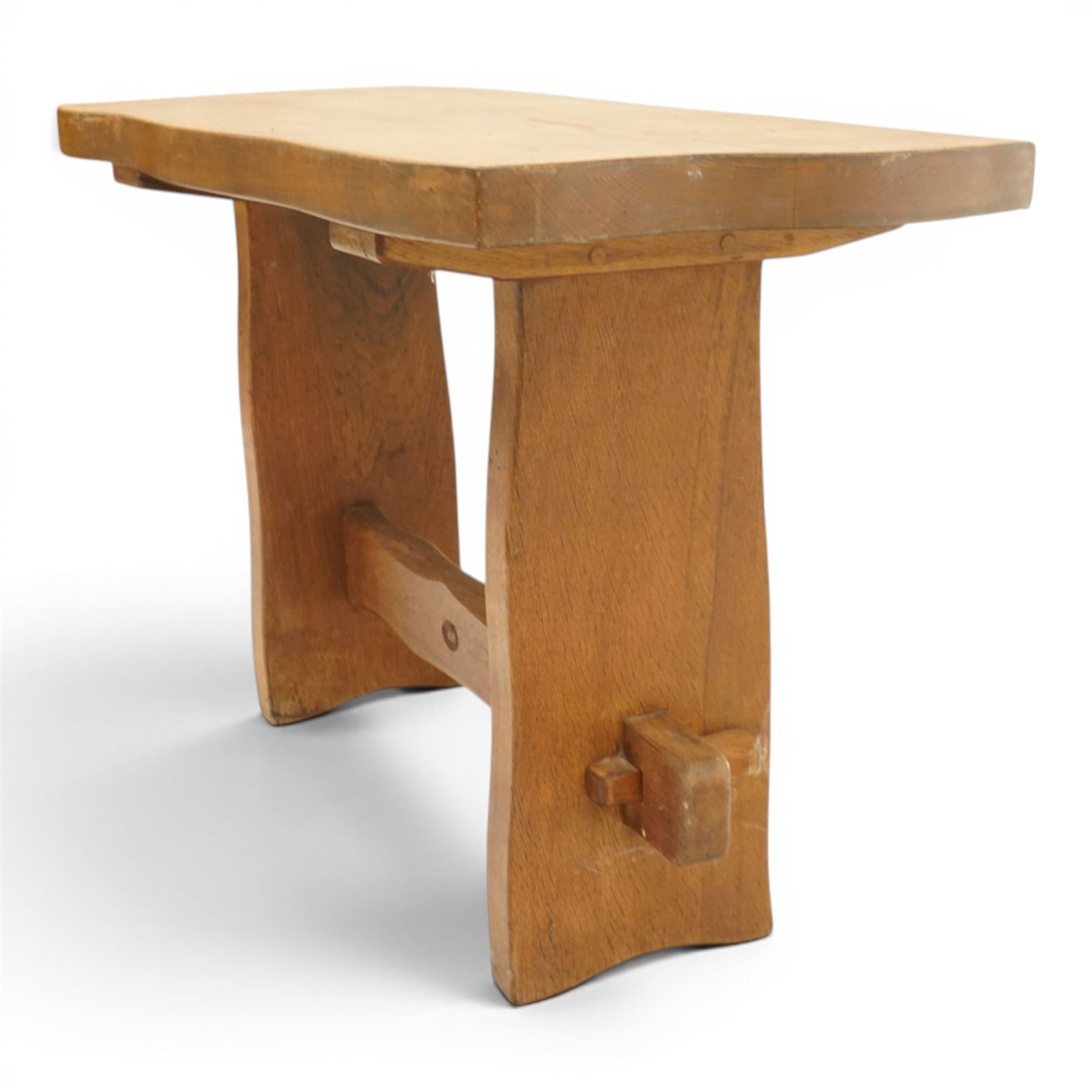 Acornman - rustic oak console table, shaped rectangular top, on shaped end supports, united by a stretcher with carved acorn signature, by the workshop of Alan Grainger, Brandsby