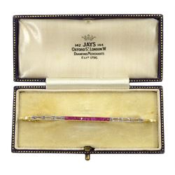 Art Deco milgrain set calibre cut ruby and diamond chip brooch, stamped 750