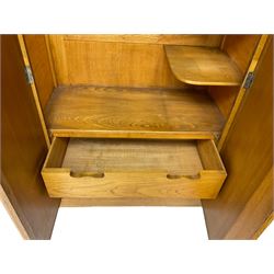 Early 20th century Art Deco period oak Gentleman's wardrobe, the interior fitted with shelves, hanging rails and two long drawers
