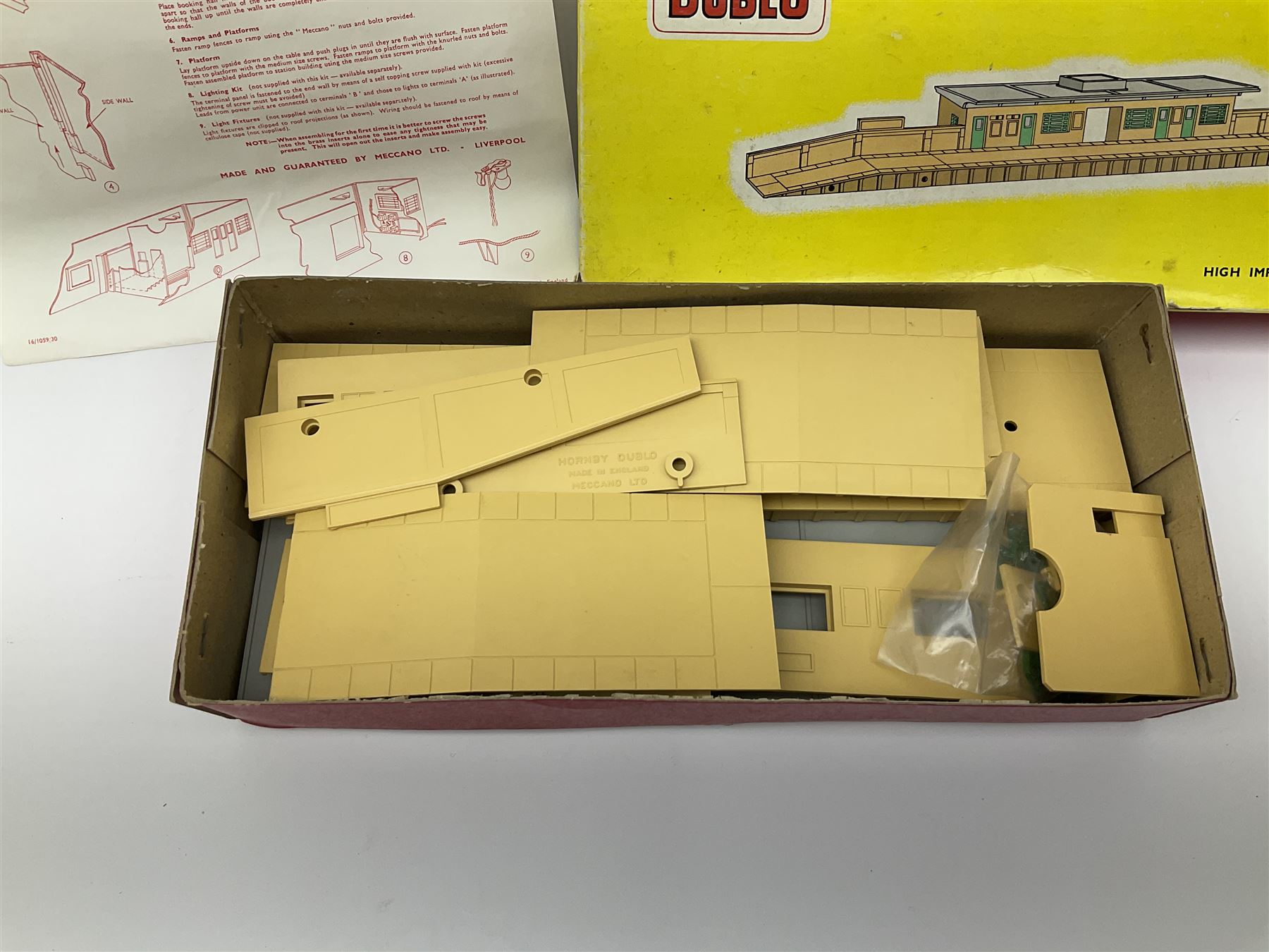 Hornby Dublo - 5006 Engine Shed Extension Kit; 5085 Suburban Station Kit with instructions; and 5030 Island Platform Kit; all in pictorial boxes; and Goods Depot Moulded Kit in box base only (4)