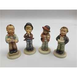 Thirty Hummel figures by Goebel, to include Saluting the Peacekeepers of Operation Joint Endeavor, on wooden plinth, Call to Glory, Celebrate with Song and Soldier Boy