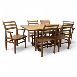 Treske of Thirsk - solid oak refectory dining suite, rectangular top with chamfered edge over trestle base united by a central stretcher, together with six matching slat back dining chairs, including two carvers, with panelled seats and square legs united by stretchers (H 87cm, W 62cm, D 57cm)