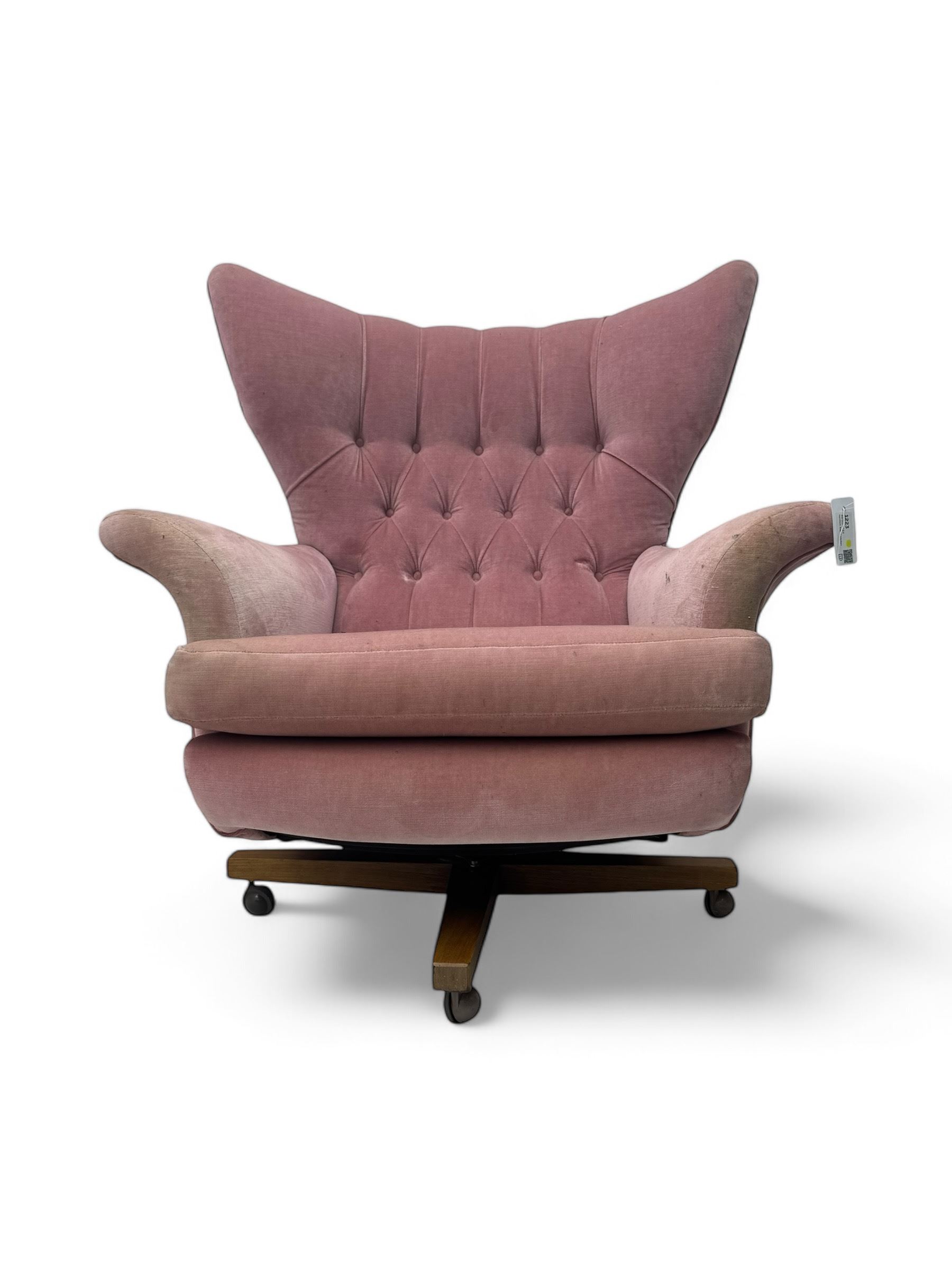 Paul Conti for G-Plan - 'Blofeld' Model 6250 swivel wingback armchair, upholstered in pink velour button back fabric, on teak base with castors