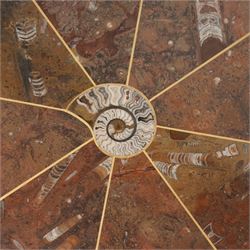 Octagonal specimen table with brass inlay, the limestone tabletop with a central ammonite and orthoceras and goniatite inclusions, upon a stepped octagonal base 