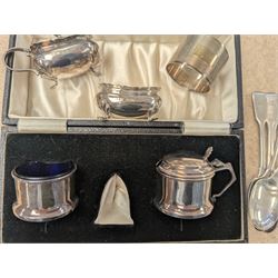 Group of silver, comprising mustard pots, open salts, napkin ring, spoons, sugar tongs and fruit knife, all stamped or hallmarked 